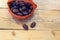 Dates and basket on a wooden table