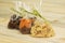 Dates, dried apricots, prunes, raisins on wooden background. Dried Fruits for Gift.