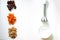 Dates, dried apricots, walnuts, blender on a white background