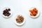 Dates, dried apricots, walnuts on a white background