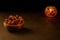 Dates in wooden bowl and lantern on stone table. Muslim holy month Ramadan Kareem. Copy space