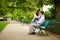 Dating couple on a bench in a Parisian park