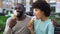 Dating couple eating ice-cream, sitting on city bench, having fun together, love