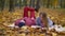 Dating couple reading a book in autumn nature