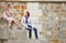 Dating couple sitting on the Seine embankment