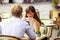 Dating Couple Together in a Parisian Street Cafe