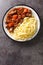 Daube Provencal classic French stew beef is slow simmered to tenderness served with noodles closeup in the plate. Vertical top