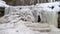 Dauda waterfall in winter. Small Frozen waterfall in Gauja national park Latvia