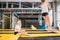 Daughter Bouncing On Trampoline while Mother watch for safety