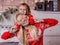 Daughter closes her mother`s eyes, photo in Christmas decorations