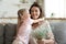 Daughter cuddle mother make pleasant surprise for her gave flowers