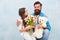 Daughter and father celebrate birthday. girl greeting dad with fathers day. happy family portrait with teddy bear