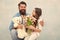 daughter and father celebrate birthday. girl greeting dad with fathers day. happy family portrait with teddy bear