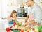 daughter father kitchen food preparing cooking child bonding happy girl together home parent