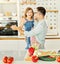 daughter father kitchen food preparing cooking child bonding happy girl together home parent dancing fun