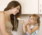 daughter feeding mother - picture of mother and daughter eat healthy food