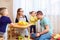 The daughter feeds her dad with an apple in room