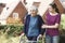 Daughter Helping Senior Mother To Use Walking Frame