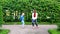 Daughter with her mother meditating while dancing on nature