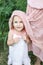 Daughter hugs mother, family photosession in flowers