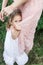 Daughter hugs mother, family photosession in flowers