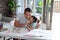 Daughter kiss father on his cheek while studying together