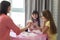 Daughter and mom hold chicken eggs before starting to color them