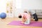 Daughter and mother doing same yoga action