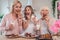 Daughter, mother and grandmother cooking on kitchen. Women generation baking together