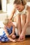 Daughter Painting Mother\'s Toenails At Home