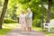 Daughter with senior mother walking at summer park