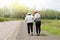 Daughter take care elderly woman walking on street