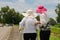 Daughter take care elderly woman walking on street