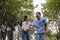 Daughter takes care of father and helps Support, Encourage him during his illness at hospital garden. The happiness of old adult