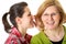 Daughter whisper to her mom, secrecy concept