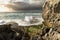 Daunting coastline with jagged rock formations.