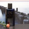 Davidoff Cool Water, Eau de Toilette, large perfume bottle in front of the picture of a groyne in the sea decorated with an Englis