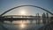 Dawn on the background of the bridge in the Dubai Greek area. Shooting in motion with an electronic stabilizer.