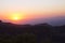 Dawn bathes the Catalina Mountains of Arizona with layers of red and yellow