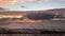 Dawn at black reef covered with seaweed in winter in Kapaa on Kauai Island, Hawaii.