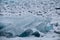 Dawn in the blue hummocks of ice lake baikal, in a snowy field i