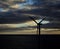 Dawn with cloudy sky and backlit windmill