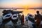 Dawn on the Ganges river, with the silhouettes of boats with pilgrims.