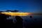 Dawn on lake. Feathered clouds glow at dawn