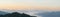 Dawn in the mountains. Amazing mountain scenery. Panoramic photo