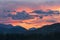 Dawn in the mountains. Colorful nature scenery with sunset or sunrise.  Atmospheric landscape with silhouettes of mountains with