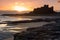 Dawn over Bamburgh Beach and Castle.