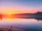 Dawn Reflections: Captivating Lake with Sunrise Pictures for Sale