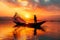 Dawn ritual Silhouetted fisherman on a wooden boat, casting nets