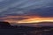 Dawn at the Rocky North beach of Arbroath with the red and orange light reflecting in the Rock Pools